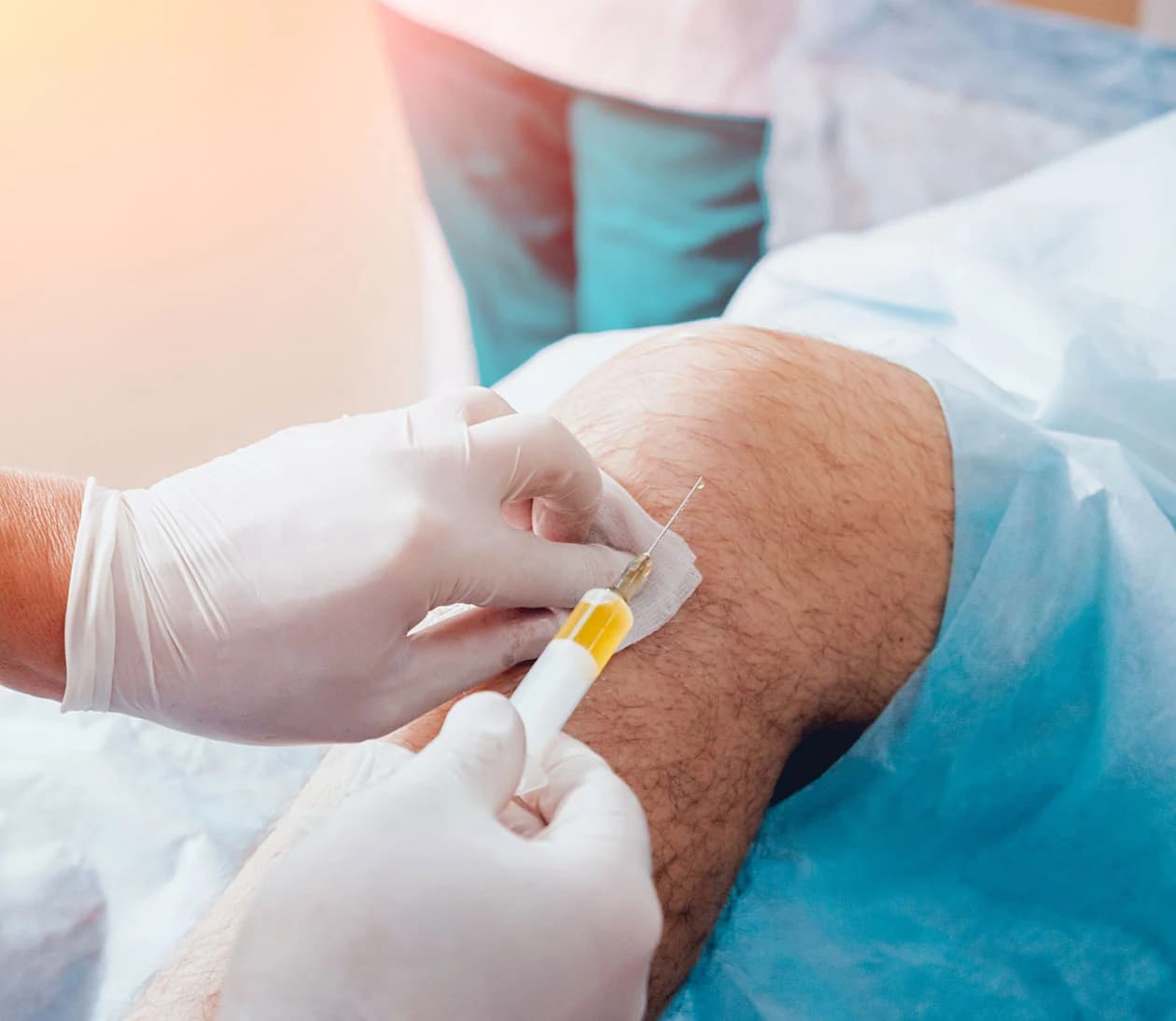 Active adult receiving PRP joint injection support for a sports injury in Geneva, IL